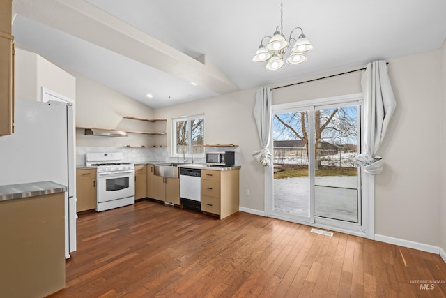 10748 W Hazelwood, Star, ID 83669 - kitchen featuring stainless steel countertops, white appliances, a sink, vaulted ceiling, and dark wood-type flooring