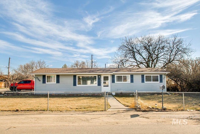 single story home featuring a fenced front yard