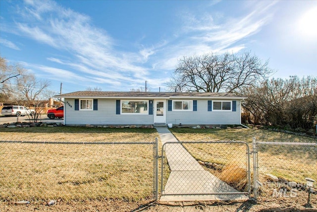 ranch-style house featuring a fenced front yard, a front yard, and a gate