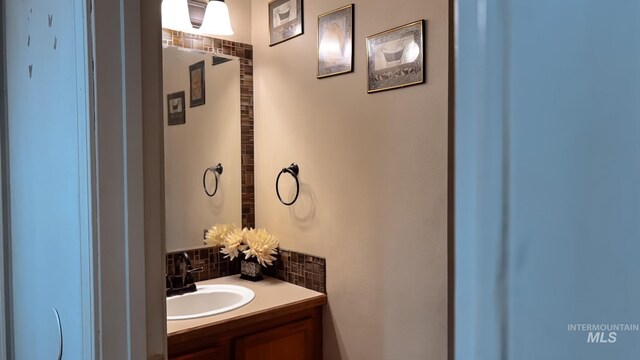 bathroom with vanity and backsplash