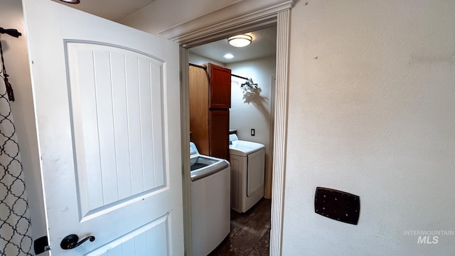 laundry room with laundry area and washer / clothes dryer