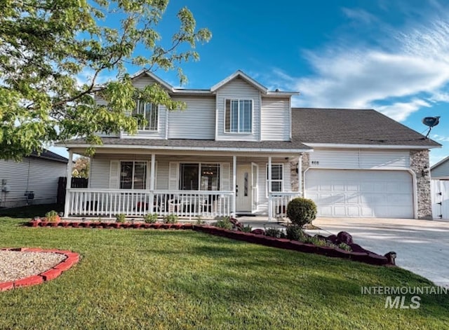 traditional-style home with concrete driveway, a front yard, covered porch, and a garage