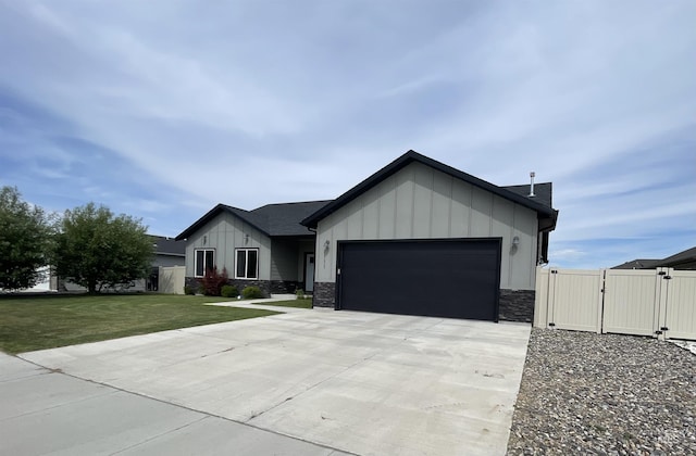 1111 Thunder Mountain St, Kimberly, ID 83341 - view of front of house featuring a gate, board and batten siding, a garage, driveway, and stone siding