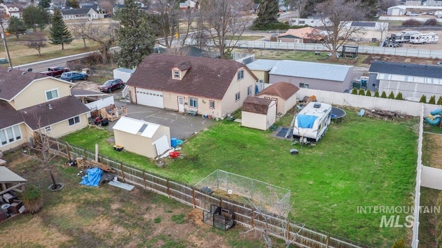 birds eye view of property with a residential view