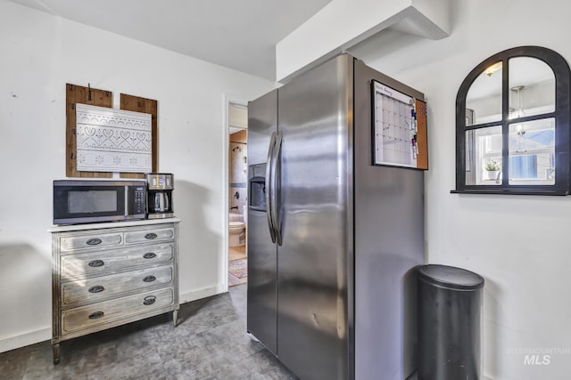 kitchen featuring baseboards and appliances with stainless steel finishes