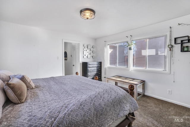 carpeted bedroom with baseboards