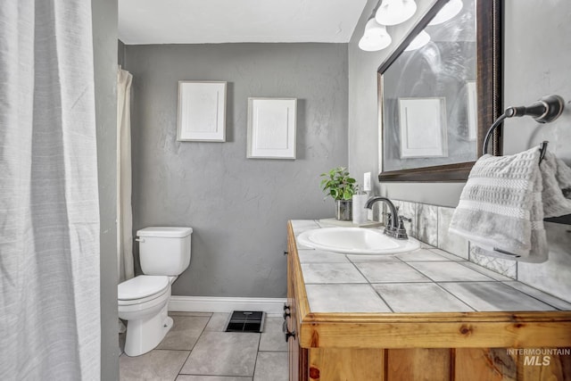 full bathroom featuring tile patterned flooring, toilet, visible vents, vanity, and baseboards