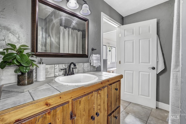 bathroom with vanity, a shower with shower curtain, and tile patterned floors