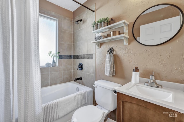 full bathroom featuring toilet, a textured wall, shower / bath combo, and a wealth of natural light