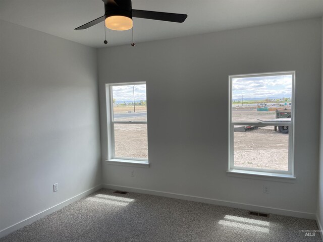 484 Hope Ave, Twin Falls, ID 83301 - unfurnished room featuring carpet flooring, baseboards, and ceiling fan