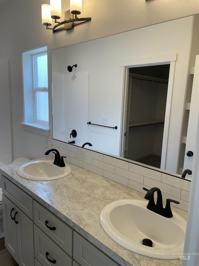 484 Hope Ave, Twin Falls, ID 83301 - bathroom featuring double vanity, a shower, and a chandelier