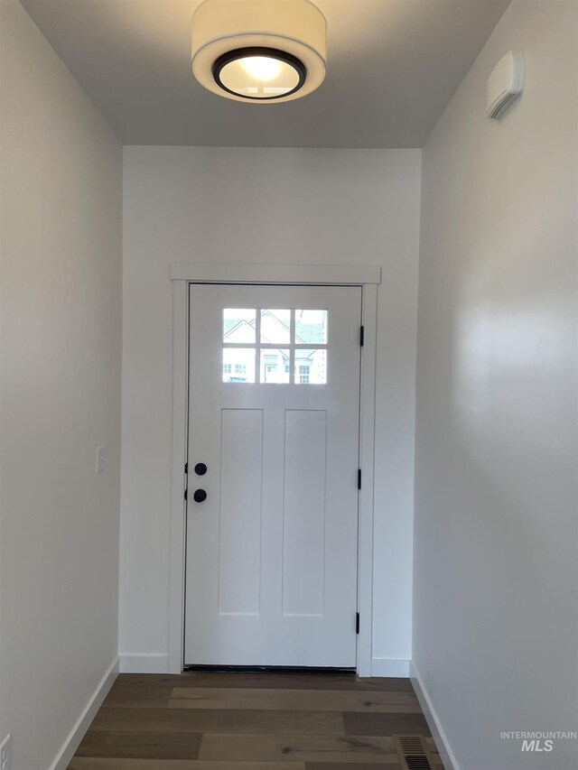 484 Hope Ave, Twin Falls, ID 83301 - doorway to outside with baseboards and wood finished floors