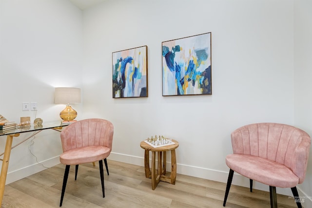 sitting room with light hardwood / wood-style flooring