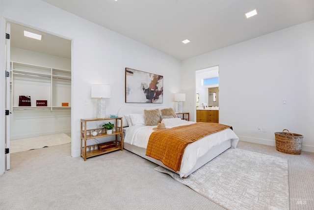 bedroom featuring carpet and ensuite bath