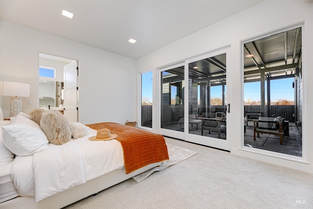 carpeted bedroom featuring access to exterior