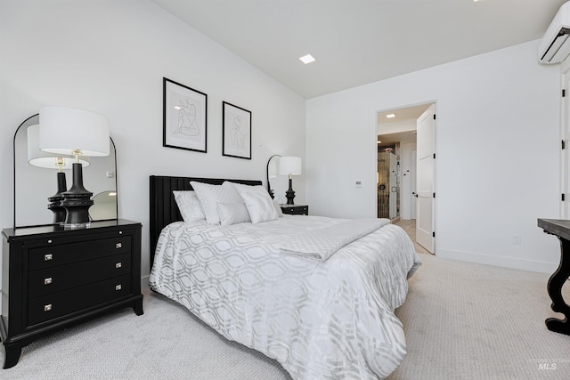 carpeted bedroom with a wall unit AC