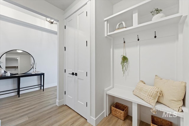 8447 W Happy Day Dr, Meridian, ID 83646 - mudroom with light wood-style floors, baseboards, and a chandelier
