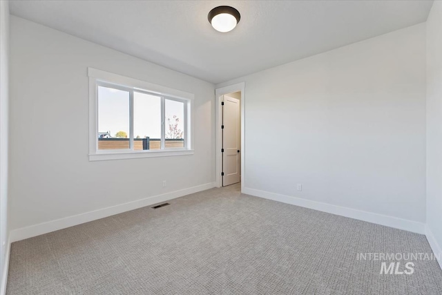 8447 W Happy Day Dr, Meridian, ID 83646 - spare room featuring carpet floors and baseboards