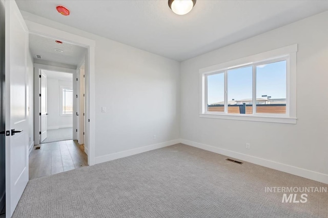 8447 W Happy Day Dr, Meridian, ID 83646 - empty room with baseboards and light carpet