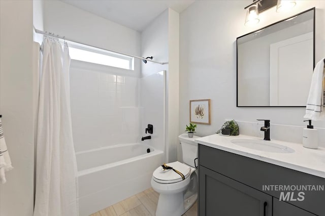 8447 W Happy Day Dr, Meridian, ID 83646 - bathroom with toilet, vanity, and shower / tub combo with curtain