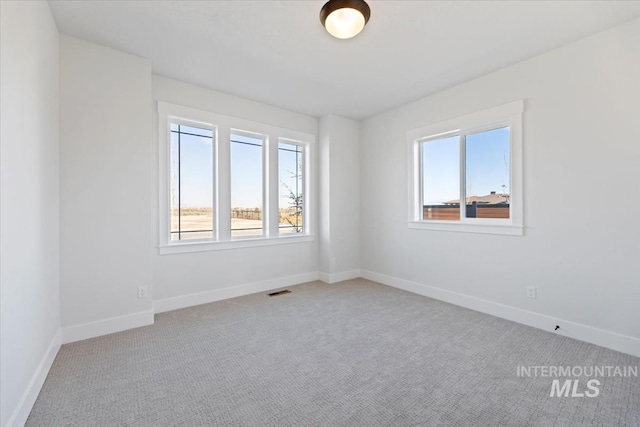 8447 W Happy Day Dr, Meridian, ID 83646 - carpeted empty room with baseboards