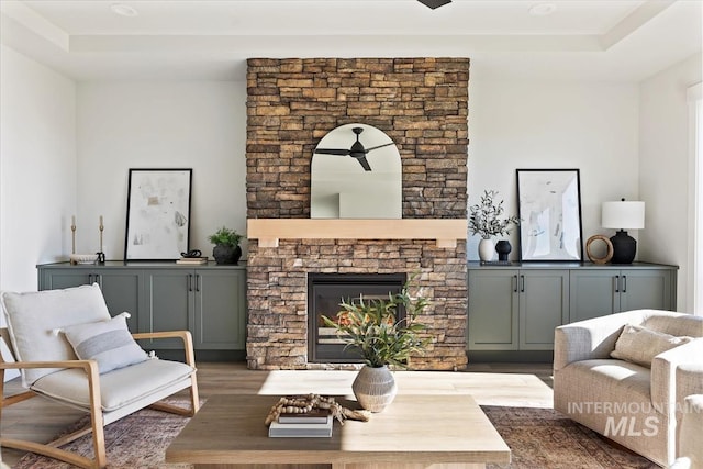 8447 W Happy Day Dr, Meridian, ID 83646 - living area featuring wood finished floors and a stone fireplace