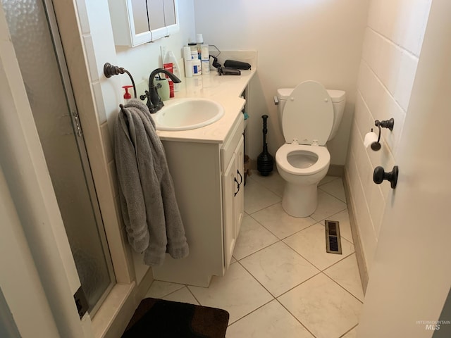 2409 S Ohio, Caldwell, ID 83605 - full bath featuring vanity, toilet, tile patterned flooring, and a shower stall