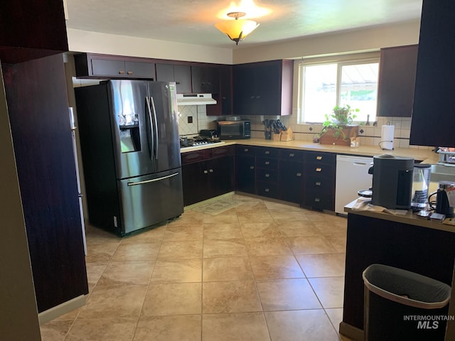 2409 S Ohio, Caldwell, ID 83605 - kitchen with stainless steel fridge with ice dispenser, white dishwasher, decorative backsplash, light countertops, and gas stovetop