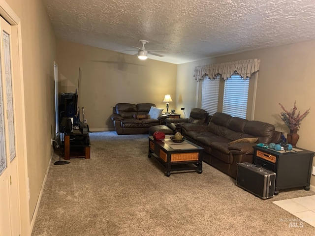 2409 S Ohio, Caldwell, ID 83605 - carpeted living area featuring a textured ceiling, a ceiling fan, and baseboards