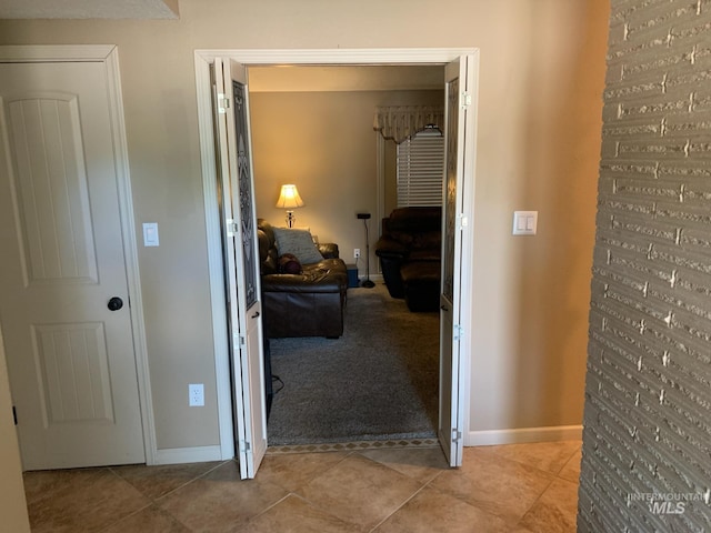 2409 S Ohio, Caldwell, ID 83605 - hall with light carpet, light tile patterned floors, and baseboards