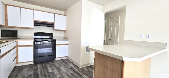 kitchen with stainless steel microwave, black range with electric stovetop, white cabinets, ventilation hood, and a peninsula