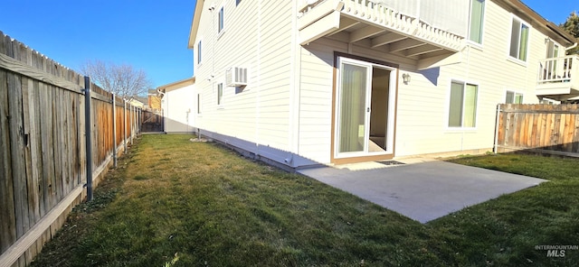 back of house featuring a yard, a patio, and a fenced backyard