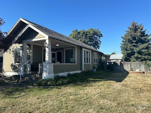 view of side of home featuring a lawn