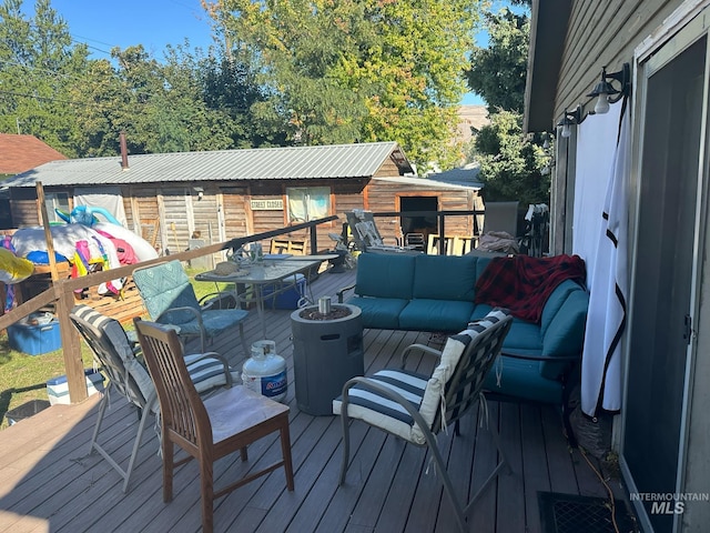 wooden deck featuring an outdoor living space