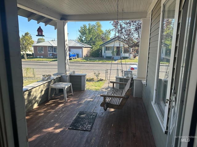 wooden terrace featuring a porch