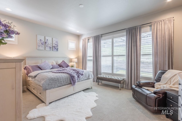 bedroom featuring recessed lighting and light carpet