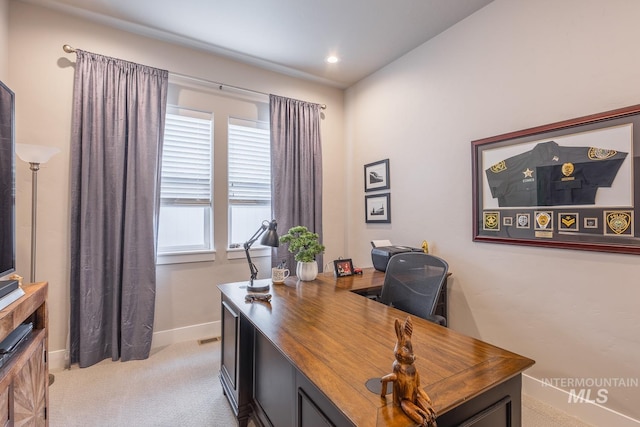 office area featuring recessed lighting, baseboards, and light carpet