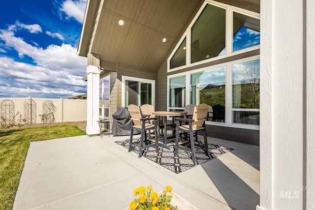 view of patio / terrace featuring fence and outdoor dining space