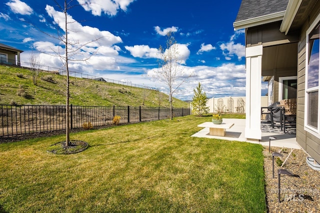 view of yard with a fenced backyard and a patio