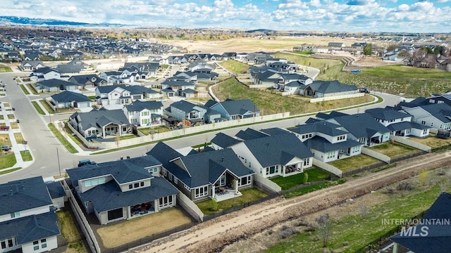 birds eye view of property with a residential view