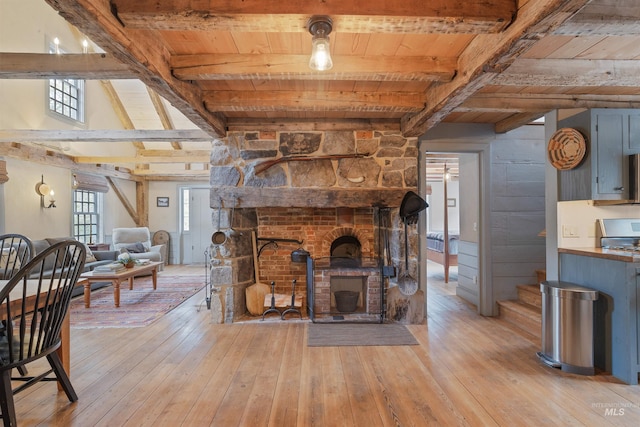 living room with beamed ceiling and wood ceiling