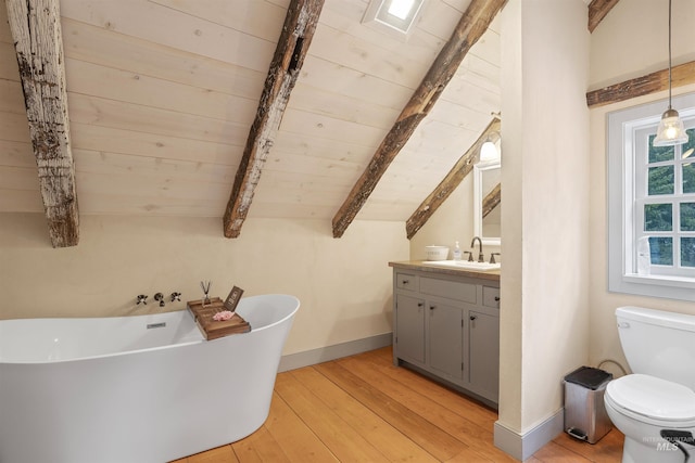 bathroom with vaulted ceiling with beams, wood-type flooring, toilet, a bathtub, and wood ceiling