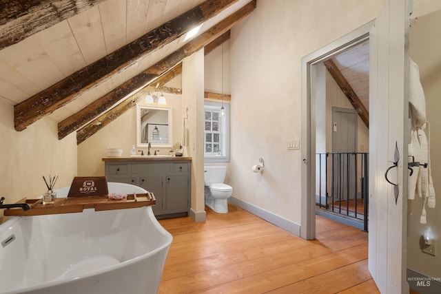 bathroom with vanity, vaulted ceiling with beams, a washtub, wood-type flooring, and wood ceiling