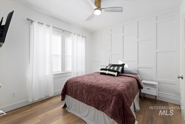 bedroom with ceiling fan and light wood-type flooring