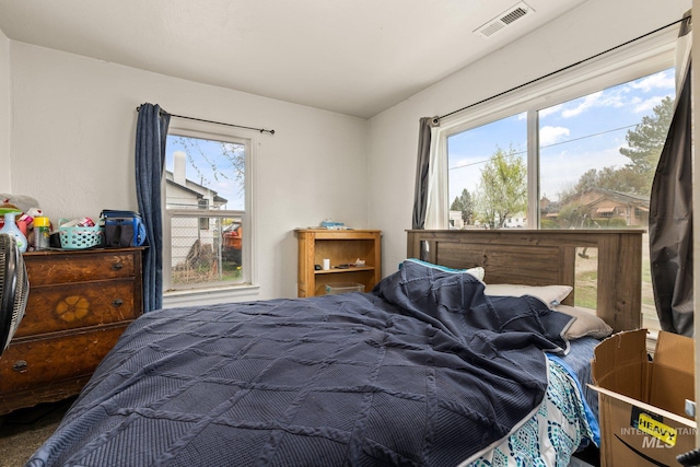 bedroom featuring visible vents