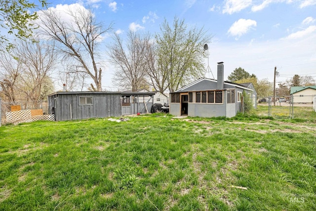 view of yard with an outdoor structure and fence