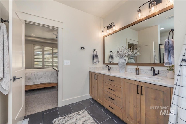 bathroom featuring tile patterned flooring and vanity