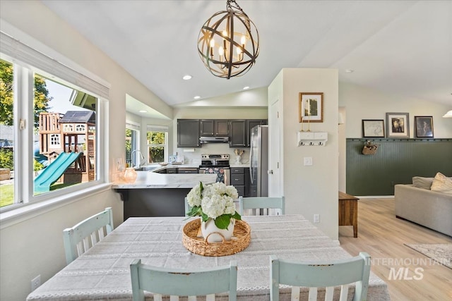 1722 W Mcglinchey St, Meridian, ID 83646 - dining area with lofted ceiling, a chandelier, light wood-type flooring, and recessed lighting