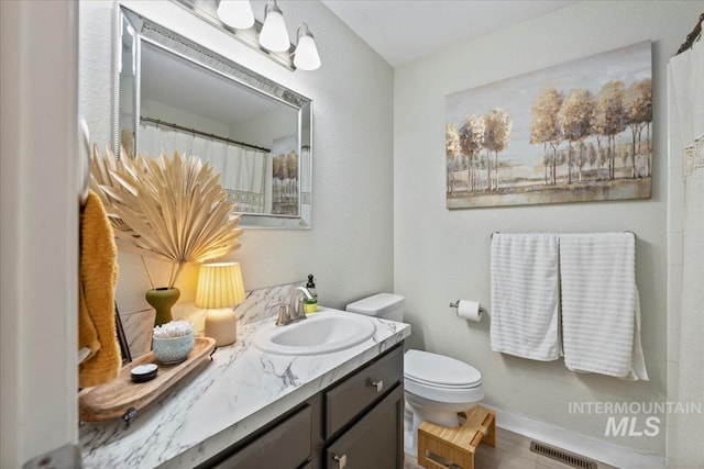 1722 W Mcglinchey St, Meridian, ID 83646 - bathroom featuring vanity and toilet
