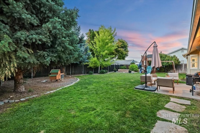 1722 W Mcglinchey St, Meridian, ID 83646 - fenced backyard featuring a patio area and an outdoor hangout area